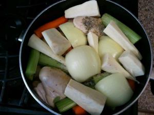 Cut up veggies and chicken in pot
